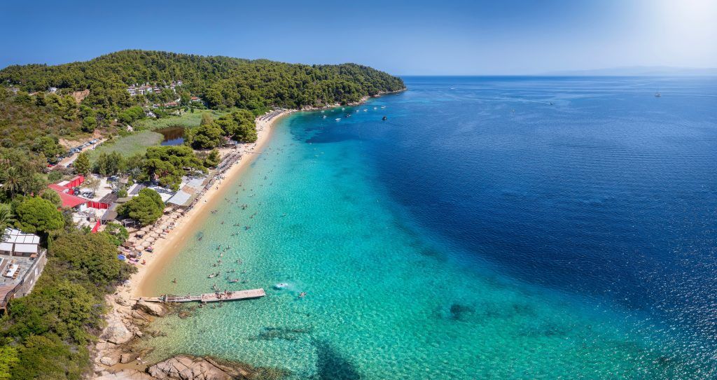 Vromolimnos Beach Skiathos 2026 – lively sandy beach with watersports and beach bars