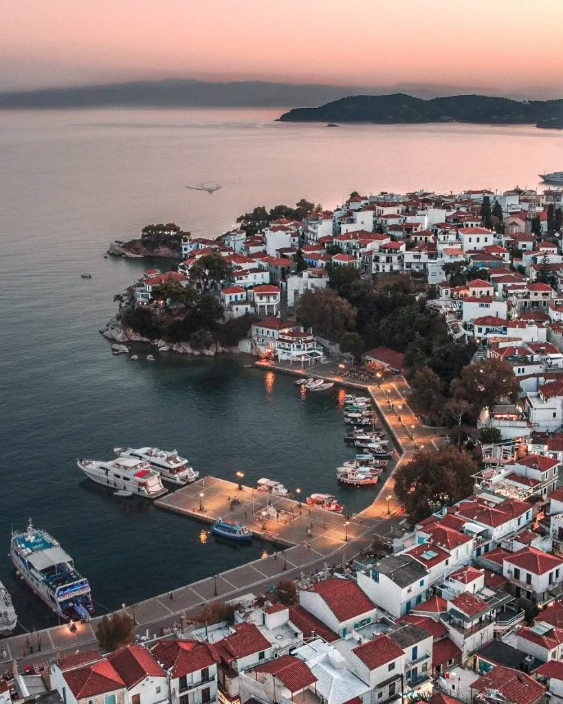 Skiathos nightlife 2025 aerial photo of the town glowing at night