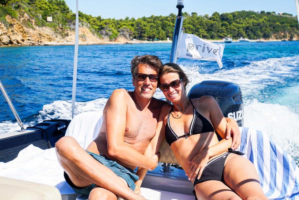 Couple enjoying a private boat rental Skiathos 2026 on the Aegean Sea