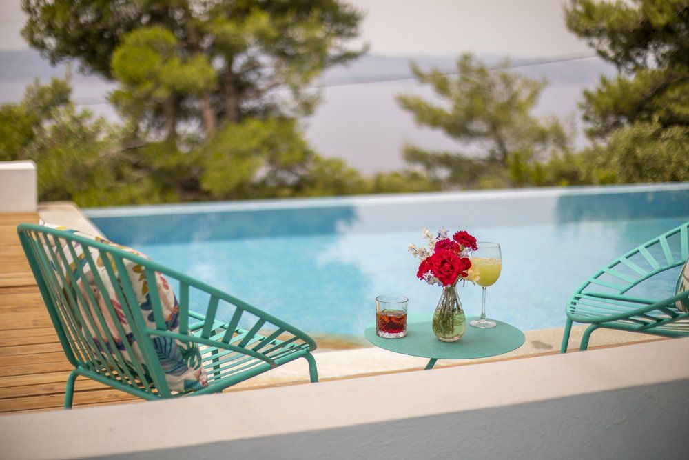 Luxury hotel pool in Skiathos Island Greece with sea view, accommodation and dining experience