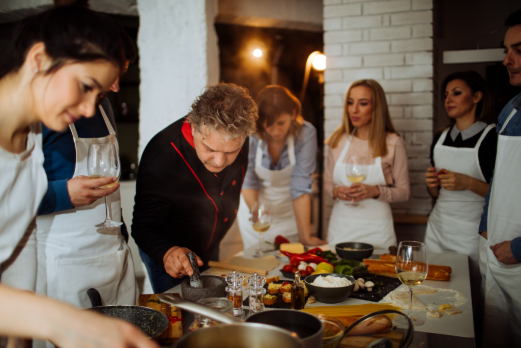 Guests learning traditional Greek recipes during a Skiathos cooking class.