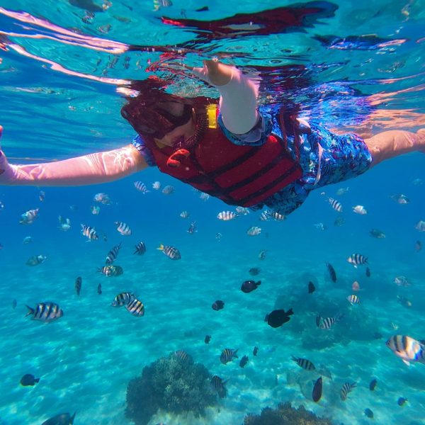 Young boy enjoying his first Skiathos diving experience in shallow waters