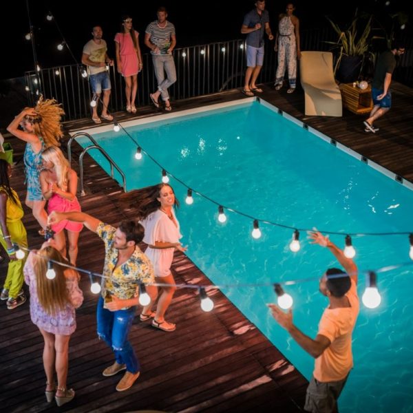 Private villa pool party in Skiathos organized by Skiathos Travellers with lighting, music, and full event coordination.