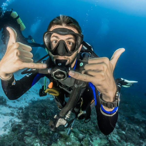 Man exploring coral reef during Skiathos diving excursion